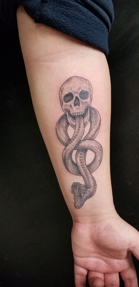 Black Grey And White Tattoo Inspired By The Dark Mark From Harry Potter