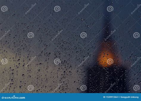 Partial Focus Of Rain Drop On Glass Window In Monsoon Season With