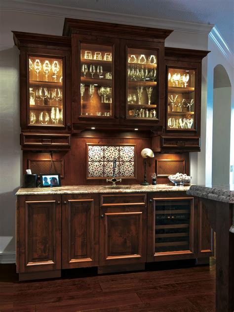 Step up your home bar game with a chic and functional bar cabinet. The Entertainer's Guide To Designing The Perfect Wet Bar