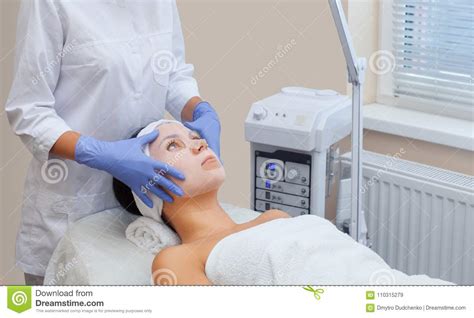 The Cosmetologist For Procedure Of Cleansing And Moisturizing The Skin