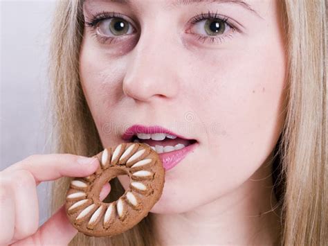 Blonde Girl Eating Cookie Picture Image 3620250