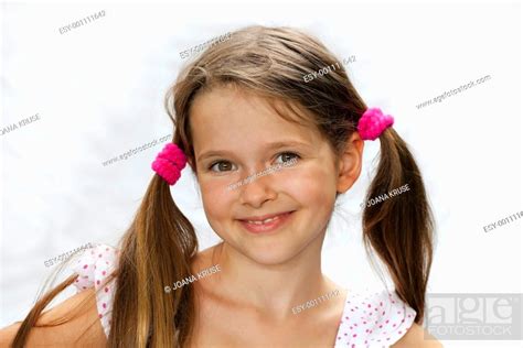 Portrait Of A 7 Year Old Girl With A Bright Background Stock Photo