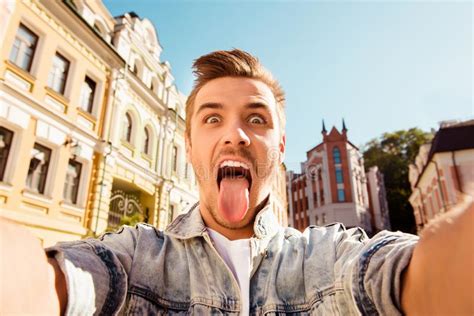Funny Happy Man Making Comic Selfie With Tongue On The Street Stock Image Image Of Handsome