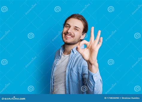 Image Of A Handsome Caucasian Boy Gesturing Approbation Sign While
