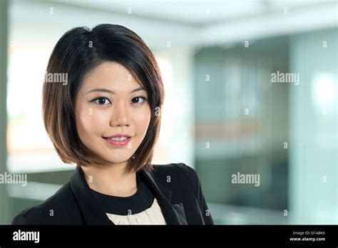 Beautiful Chinese Business Woman With Friendly Smile Stock Photo Alamy