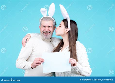 Happy Easter Couple Kissing Bunny Rabbit Woman And Man Hold Board Paper For Text Copy Space