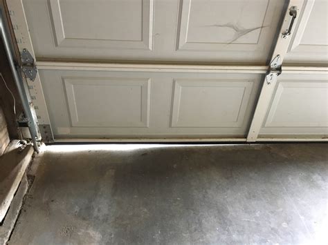 How Do I Fix This Gap On The Bottom Side Of My Garage Door