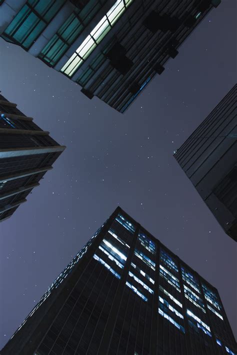 Low Angle Photography Of Curtain Wall Buildings During The Night