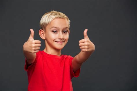 Free Photo Smiling Little Boy Child Showing Thumbs Up