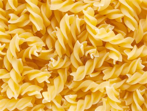 Background Of Twisted Raw Pasta Stock Photo Image Of Tubes Eating