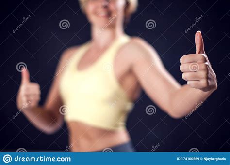 Woman In Sport Clothes Smiling And Showing Thumb Up Gesture Fitness And Healthcare Concept