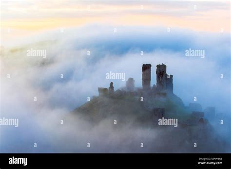 Corfe Castle In Fog At Dawn Stock Photo Alamy