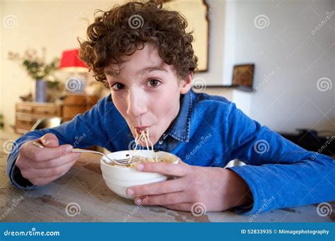 Happy Boy Eating Noodles At Home Stock Image Image Of Interior Food