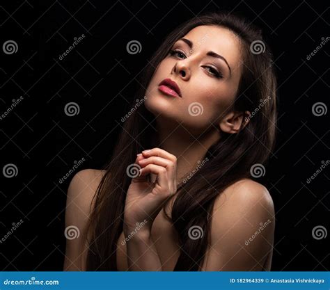 Beautiful Makeup Woman With Long Hair Looking Serious With Elegant Hand And Fungers Near The