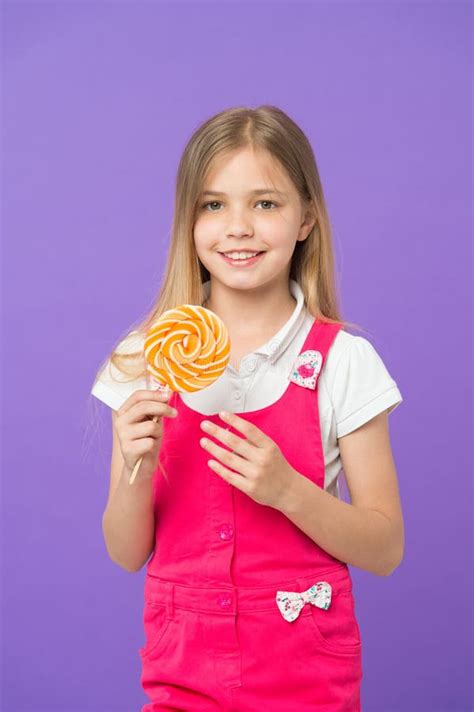 Try My Lollipop Small Child Smiling With Candy On Stick On Purple
