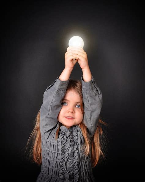 Child Holding Bright Light Bulb Stock Image Image Of Female Energy