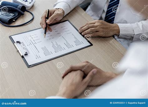 The Doctor Is Explaining The Details Of The Patient S Physical
