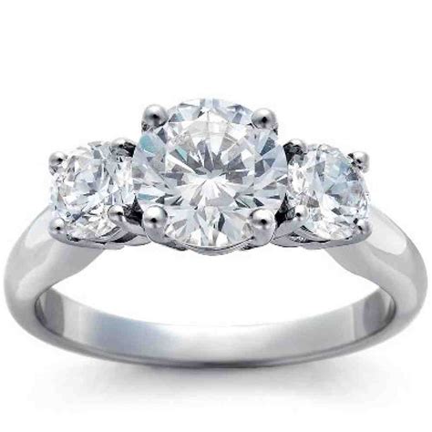 The band is designed to complement the engagement ring for a cohesive look. Three Stone Diamond Engagement Rings - Wedding and Bridal Inspiration