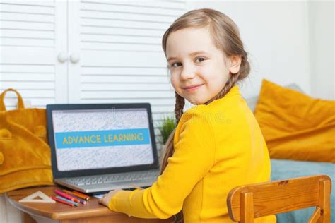 Smiling Child Girl At Home Little Girl With Laptop Stock Photo Image