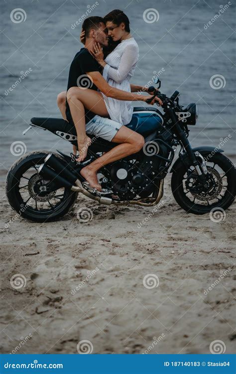 Couple Hugs On Beach Sitting On Motorcycle Stock Image Image Of