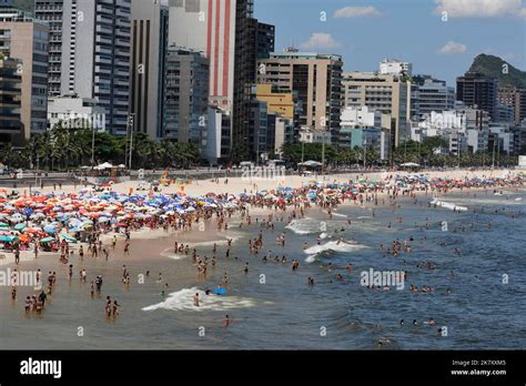 Leblon Beach Rio De Janeiro Brazil People Sunbathing Near Shore With