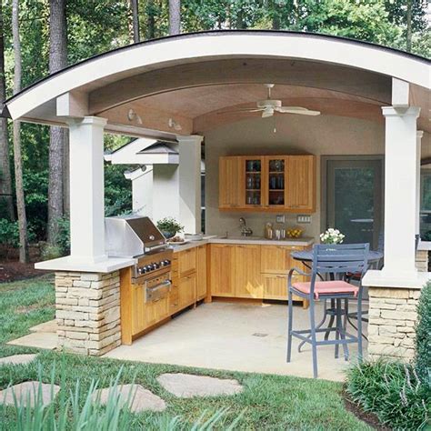 A striking outdoor kitchen with pergola idea. You Need to See These Outdoor Kitchen Ideas | Asadores de ...