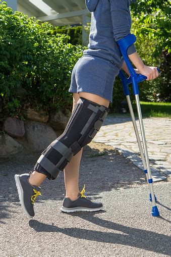 Young Woman Wearing A Leg Brace Side View Stock Photo Download Image