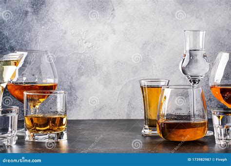set of strong alcoholic drinks in glasses in assortment vodka cognac tequila brandy and