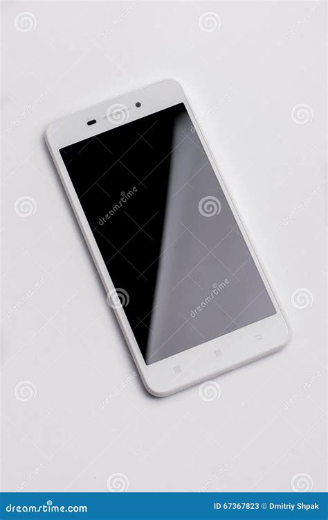 White Modern Smartphone With Blank Screen Lies On The Surface Isolated