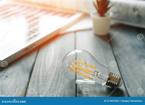 Light Bulb On Gray Wooden Table Close Up Stock Photo Image Of Concept