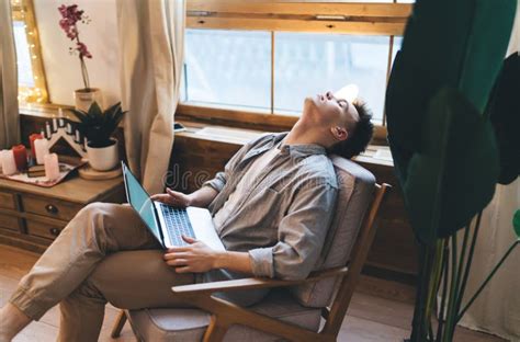 Caucasian Man Sleeping In Armchair With Laptop Stock Image Image Of