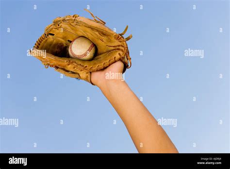 Baseball Player Catching Ball In Baseball Glove Close Up Of Hand In