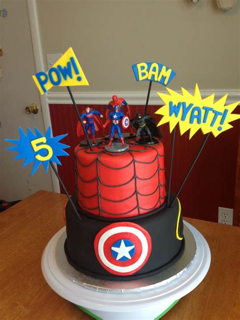 Marvel inspired cake with iron mans hand, thors hammer, captain america's shield, avengers logo this 5″ and 7″ two tier cake serves approx 26 portions. Marvel Cake Design : At cakeclicks.com find thousands of ...