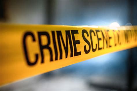 Yellow Crime Scene Tape At Nighttime Forensic Location Stock Photo