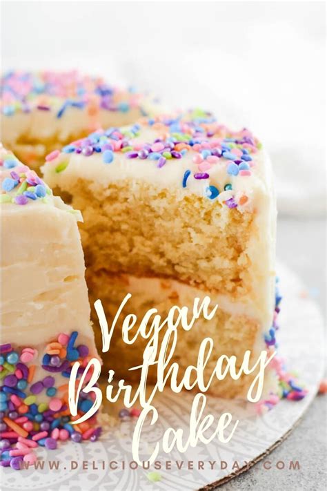A Cake With White Frosting And Sprinkles On It That Says Vegan Birthday
