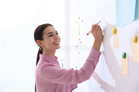 Young Teacher Writing On Whiteboard In Classroom Stock Image Image Of