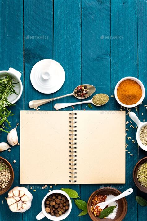 Culinary Background And Recipe Book With Various Spices On Wooden Table