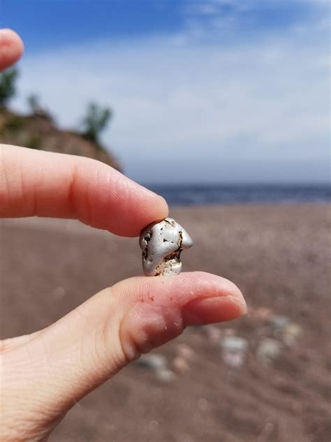 Small Shiny Silver Rock Found On Beach Of Lake Superior In Northern