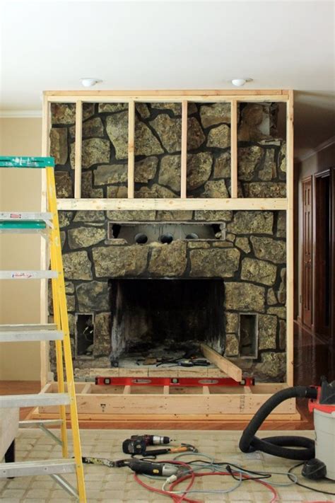 After deciding what size you want the mantel of your fireplace to be, outline the dimensions in the painter's tape on the wall. Cover Up | Our Humble Abode | Rock fireplaces, Stone ...
