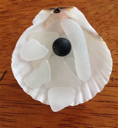 Brown seaglass marble surrounded by white seaglass. Cape Cod | Christmas ornaments, Novelty ...