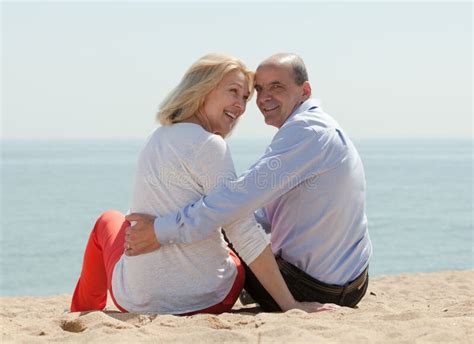 Mature Lovers Sitting On Beach Stock Image Image Of American Mature 45629709