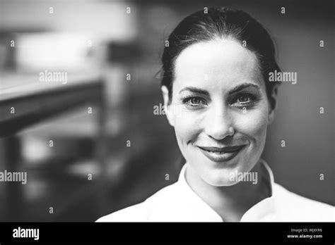 Happy Chef Smiling At Camera In A Commercial Kitchen Stock Photo Alamy