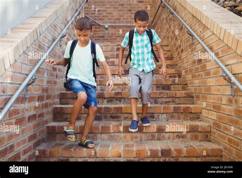Kids Going Down The Stairs Stock Photo Alamy