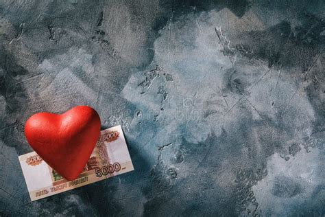 Love For Money Red Heart And Five Thousand Rubles On The Table With