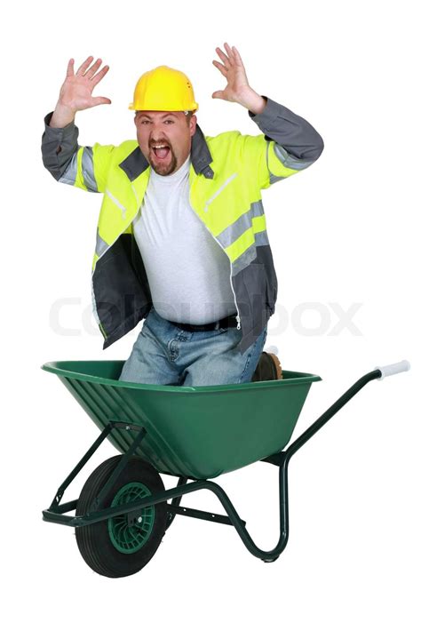 Laborer Sitting In A Wheelbarrow Screaming Stock Image Colourbox