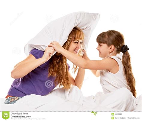 Cheerful Mother And Daughter Having Pillow Fight Stock Image Image Of Couple Daughter 58595991