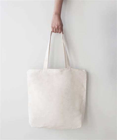 Download blank canvas tote bag design mockup with hand handmade ...