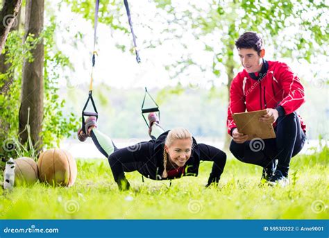 Man And Woman At Fitness Training Doing Push Ups Stock Photo Image Of