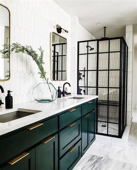 Cabinetry is one of the most important elements in your bathroom, so it's important that you choose wisely. I love the dark green cabinets in this bathroom -- seems ...