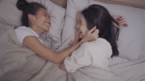 Asian Two Females Lesbian Couple Cuddle Inside Blanket Holding Hands Hug Kissing Girlfriend